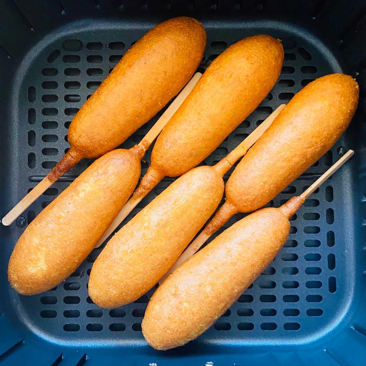 cooked corn dogs in air fryer basket