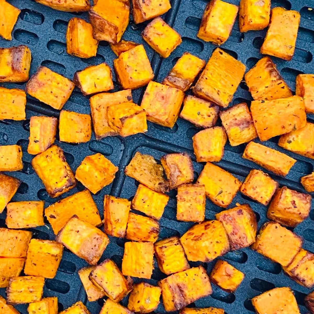 air fryer sweet potato chunks in air fryer basket