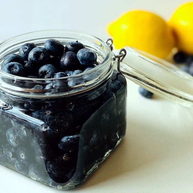 blueberry-vodka-in-jar-lemons-and-blueberries-in-background