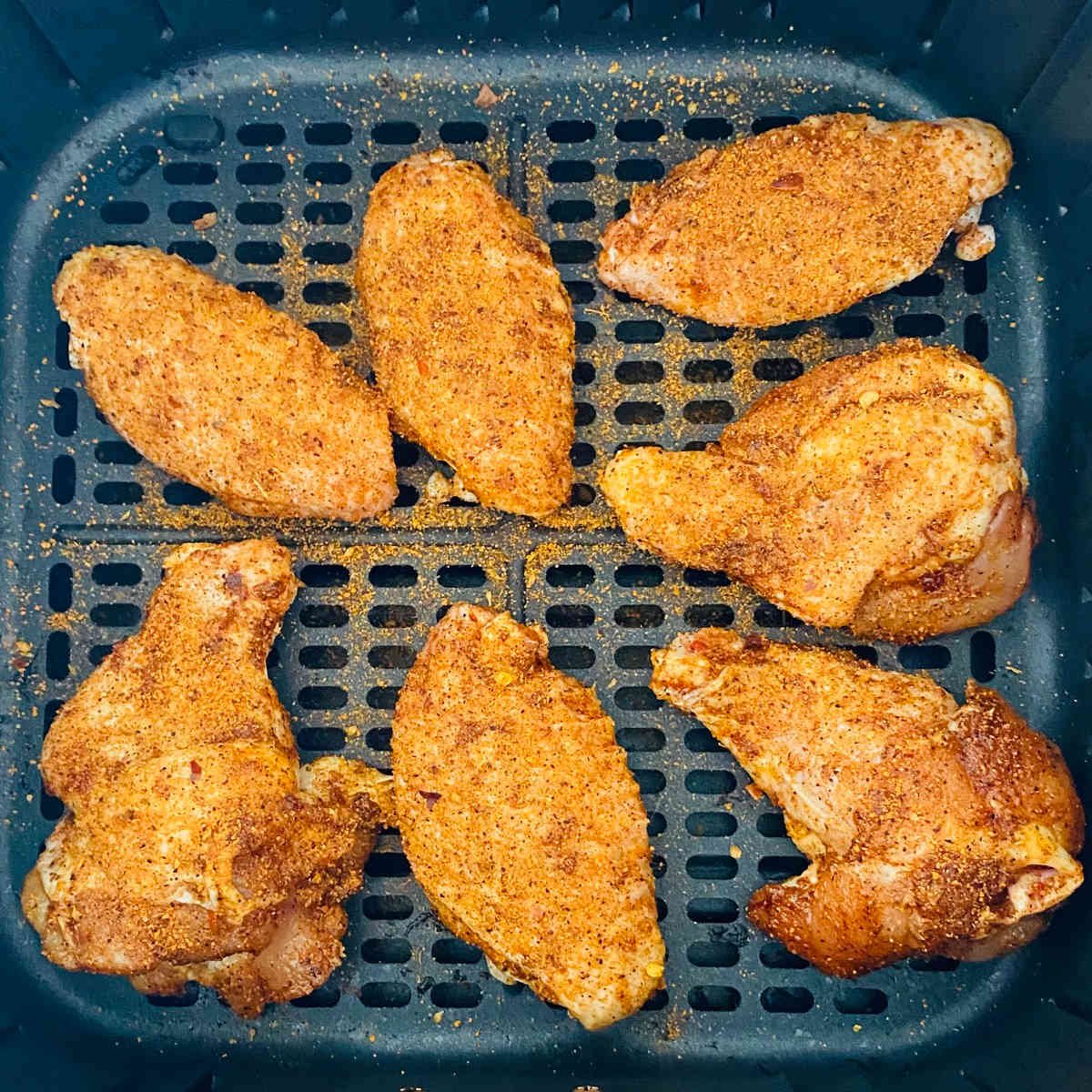 cajun wings with dry rub in air fryer basket