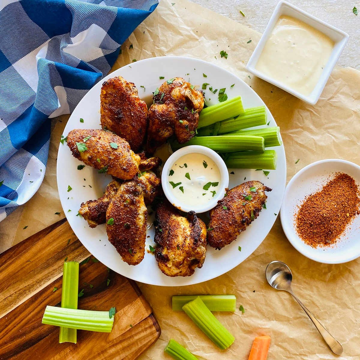 cajun dry rub wings on plate with side of chicken wing dry rub