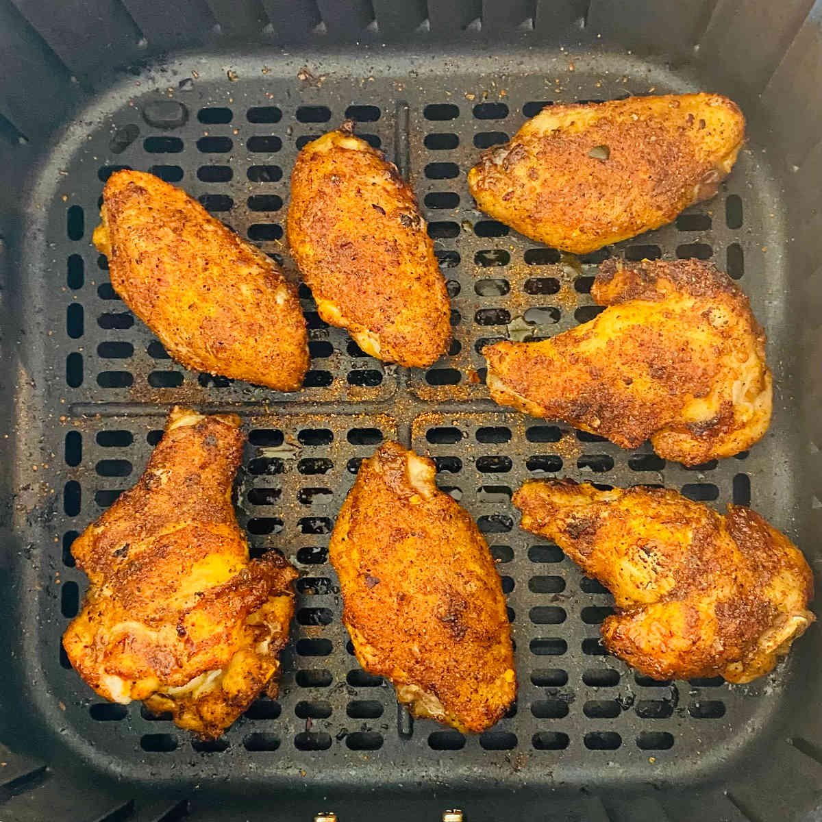 dry rub air fryer wings in air fryer basket