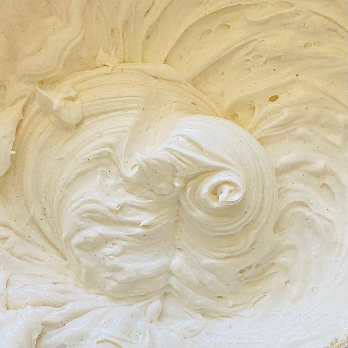 close up process shot of cream cheese frosting without butter
