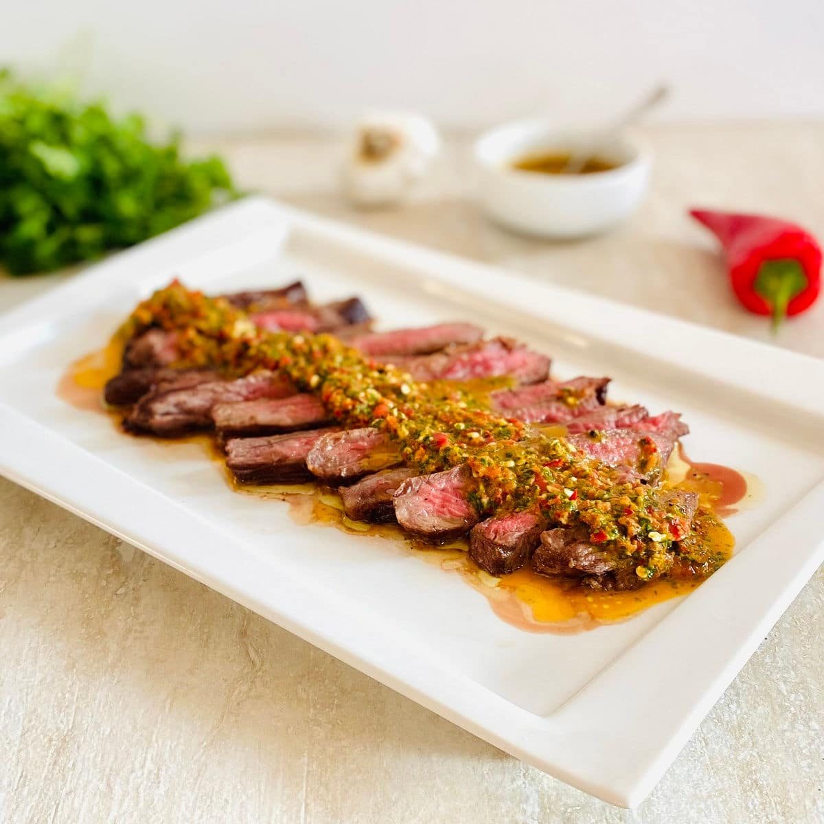 beef chuck denver steak sliced with chimichurri