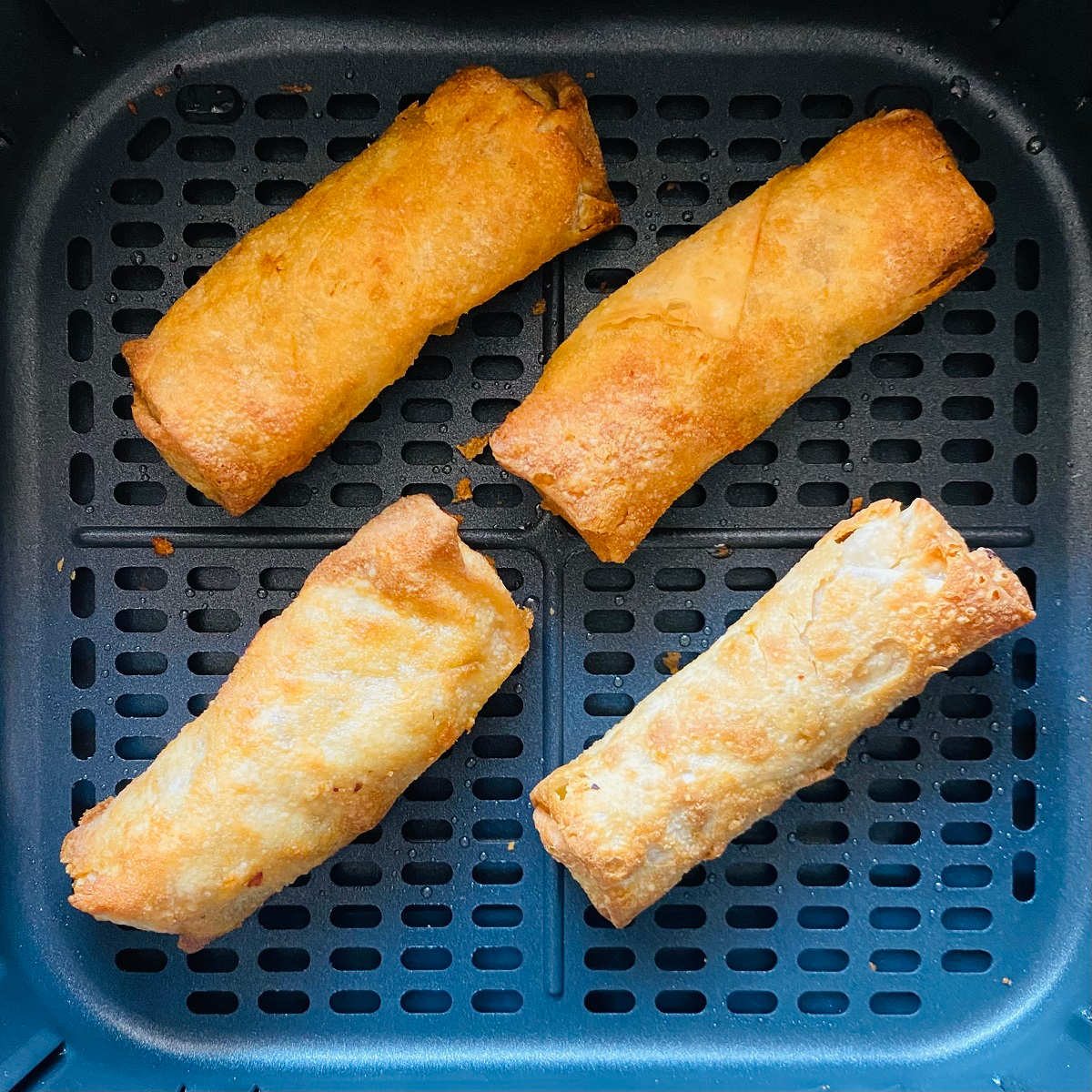 cooked frozen egg rolls in air fryer basket