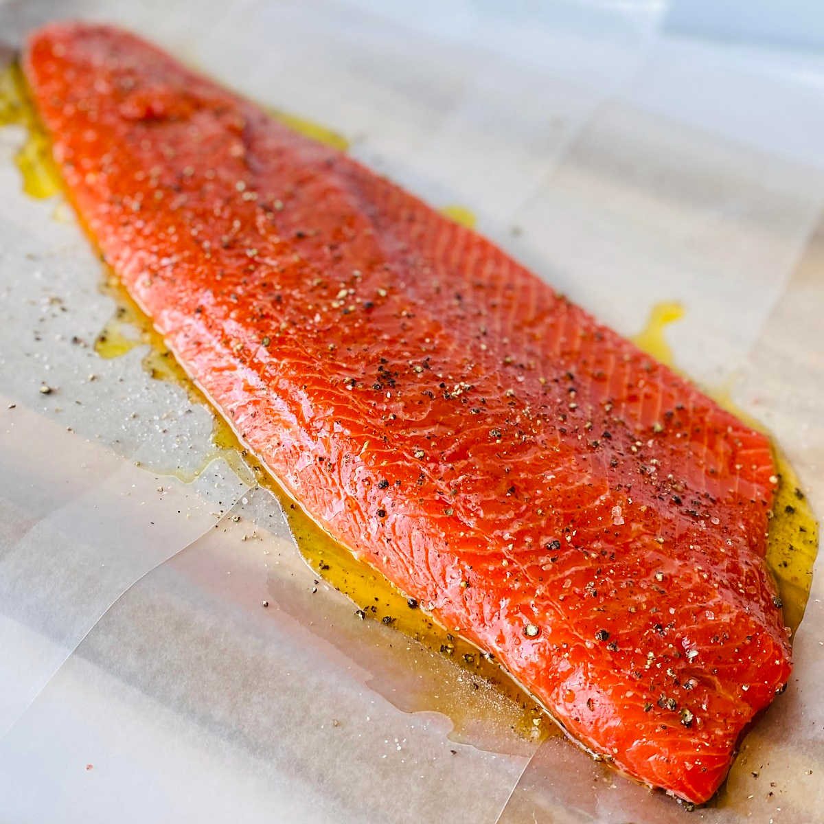 wild caught sockeye salmon covered with olive oil salt and pepper