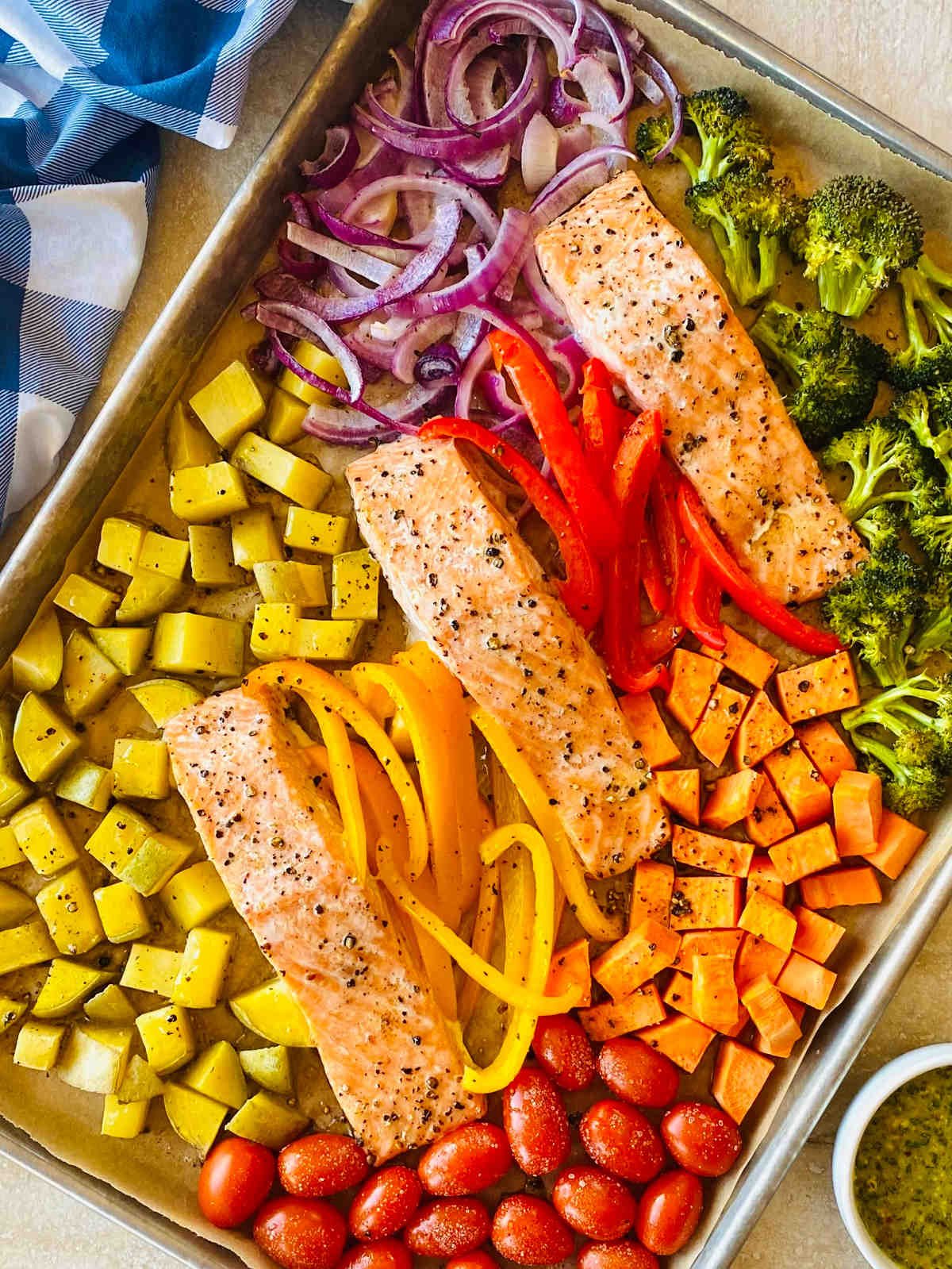 baked salmon on a sheet pan.