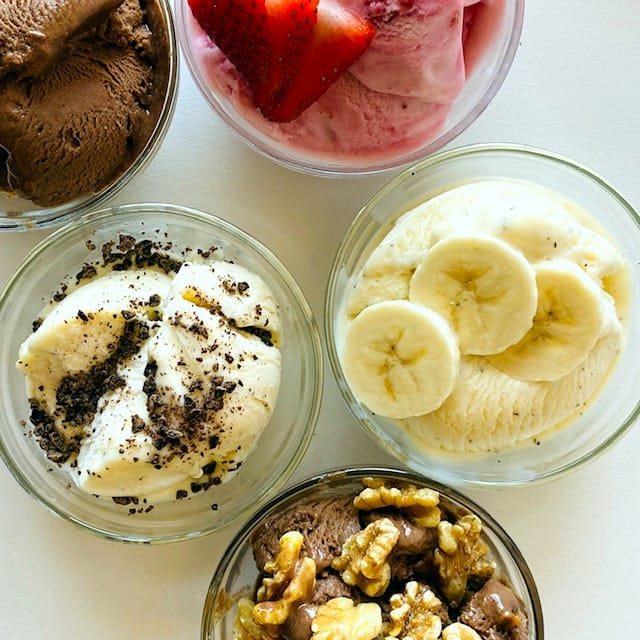 Strawberry-banana-chocolate-nice-cream-in-dishes-walnuts-and-chocolate-shavings