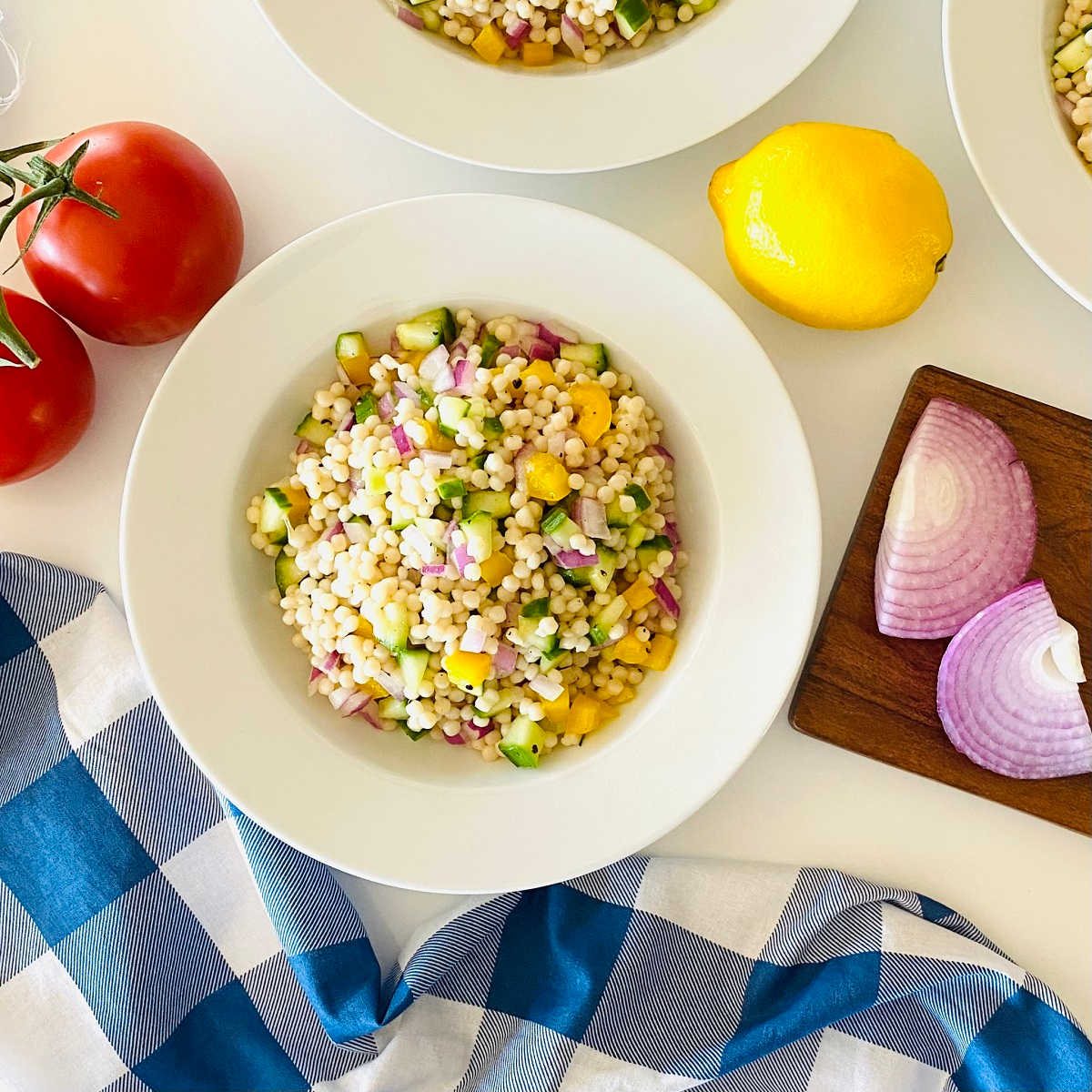 instant pit couscous surrounded by fresh vegetables