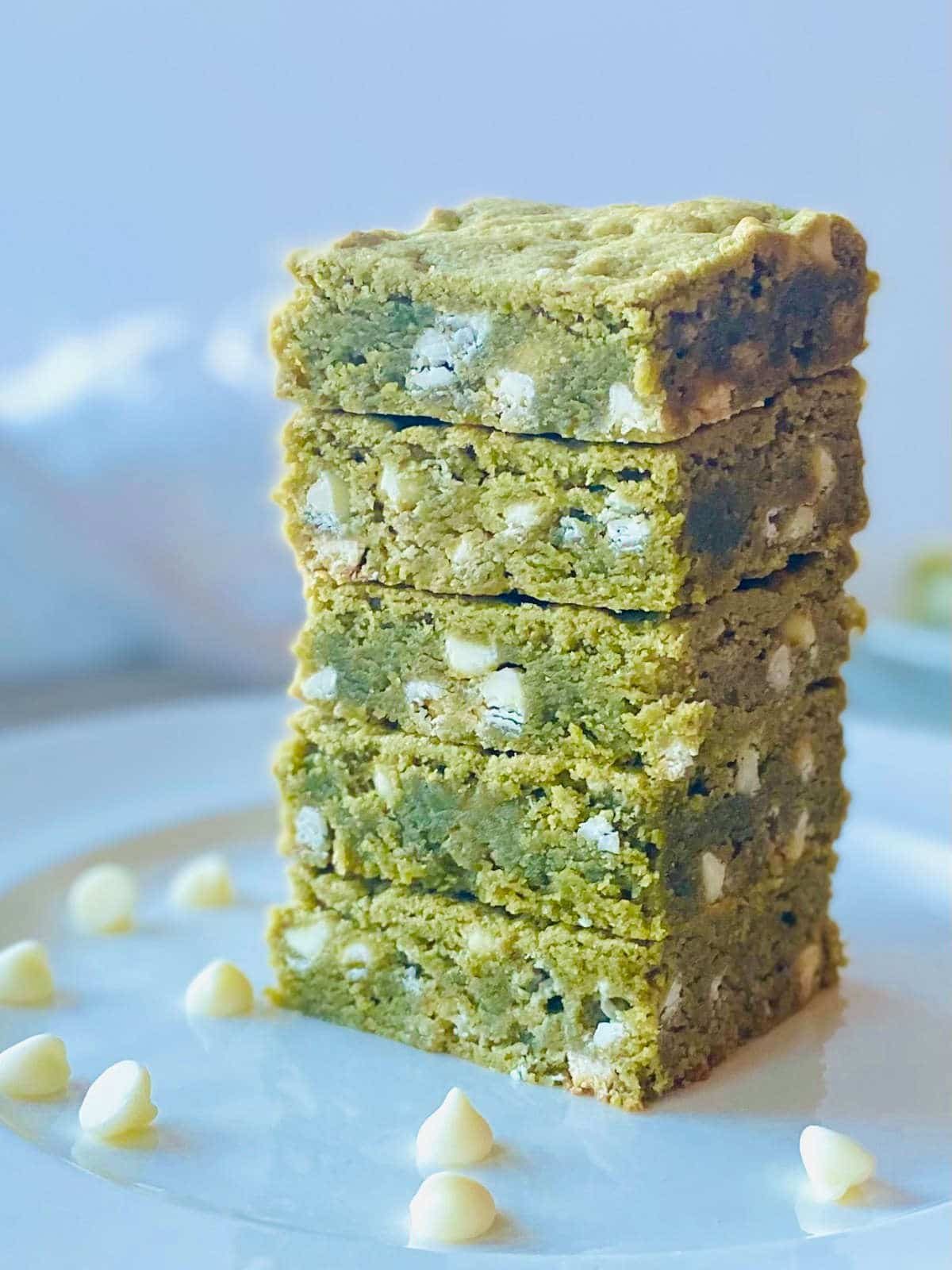 matcha white chocolate brownies in a stack