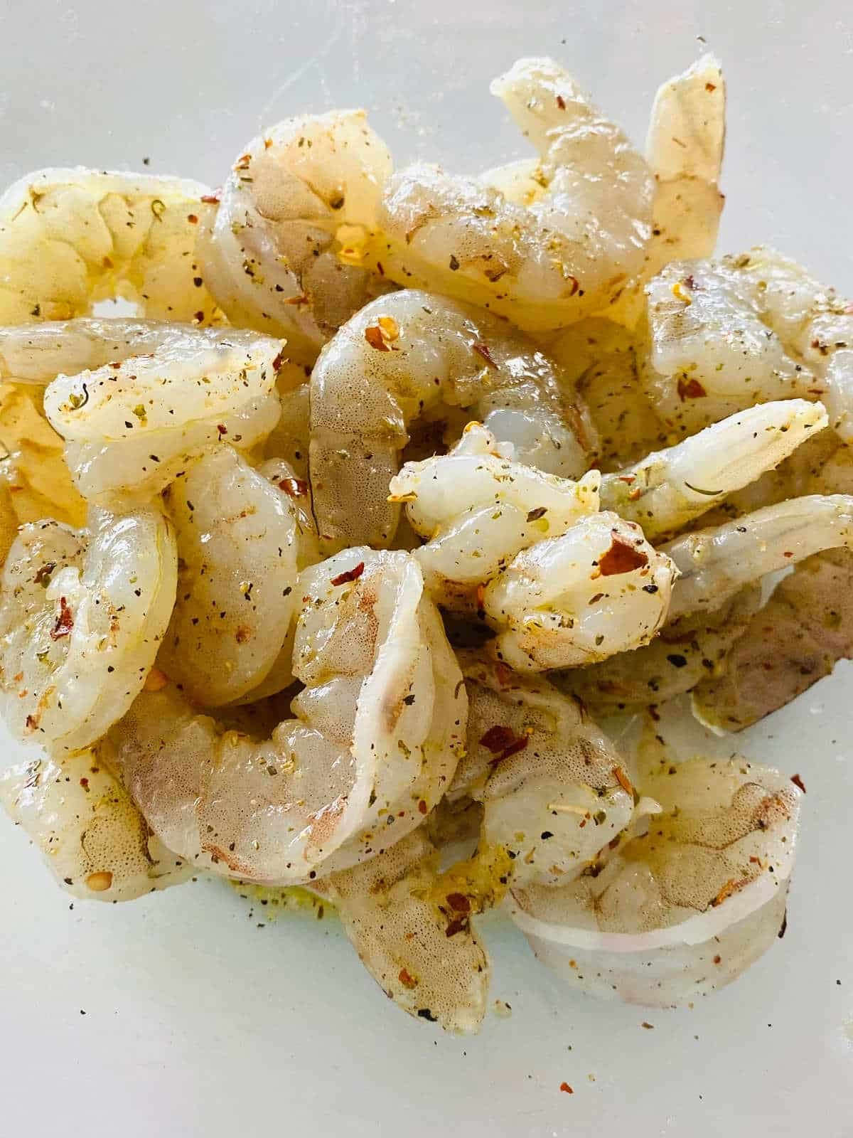raw shrimp with olive oil and seasonings.
