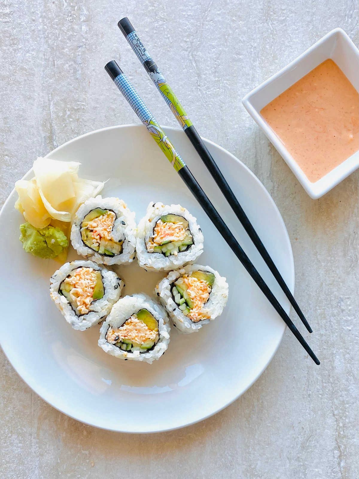 spicy crab roll sushi on a plate with sushi