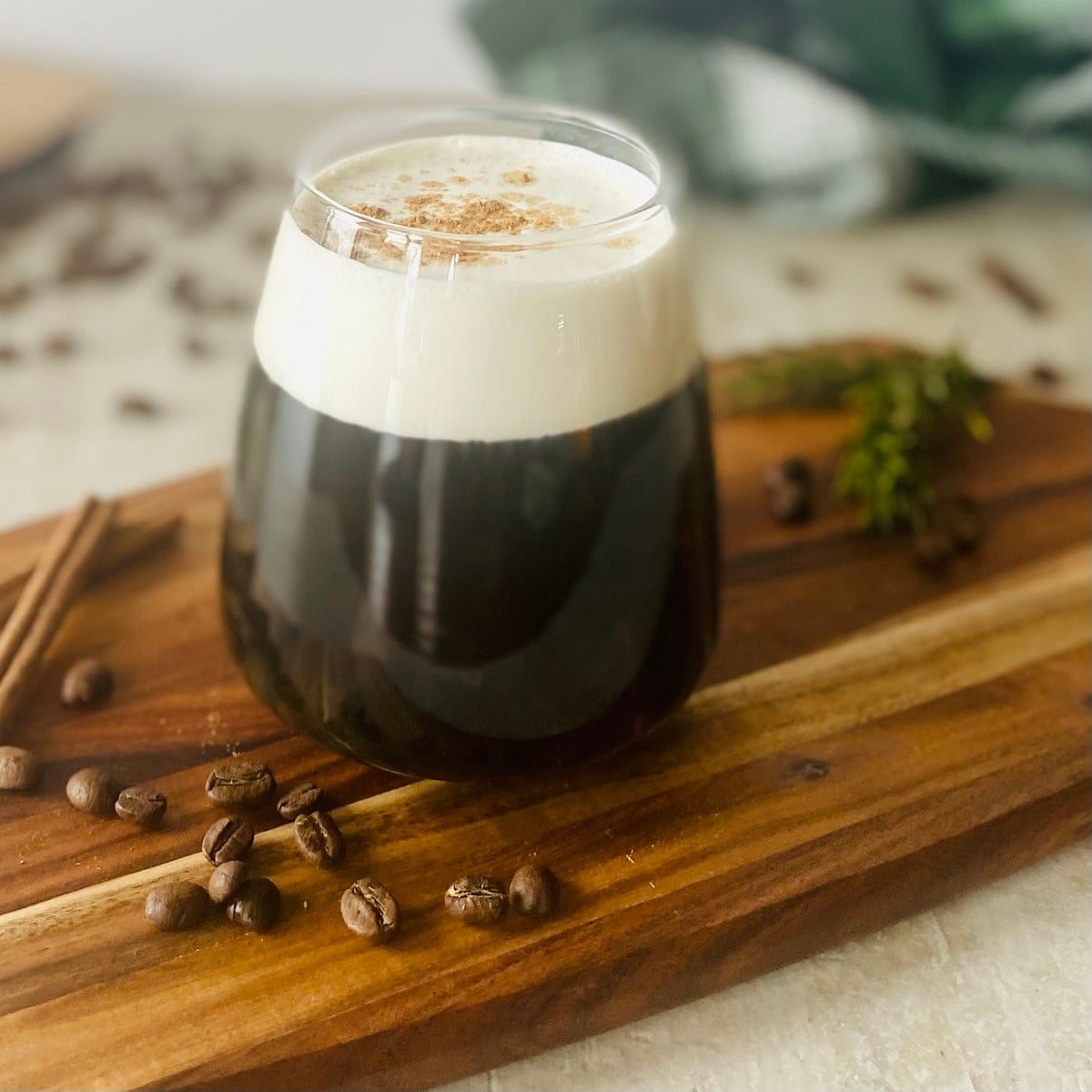 Sweet Cream Cold Foam Recipe next to coffee beans.