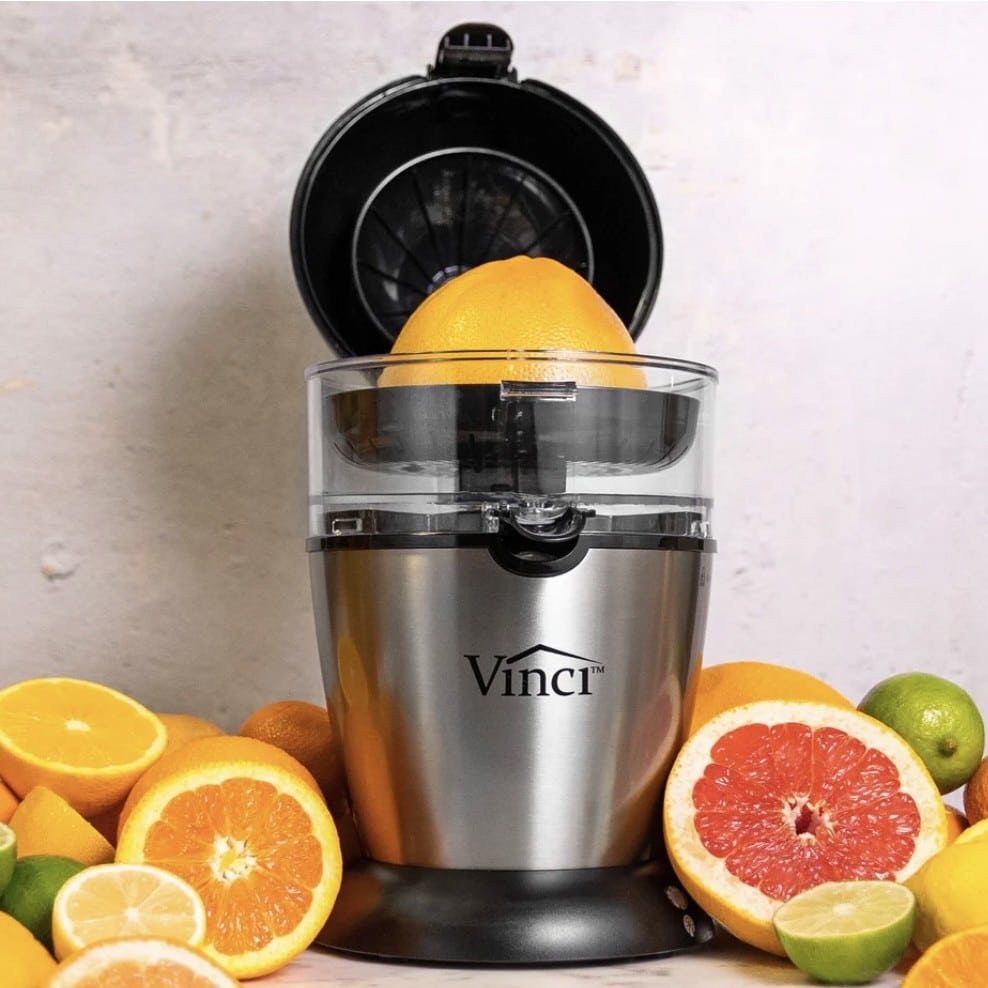 vinci housewares juicer surrounded by citrus fruit.