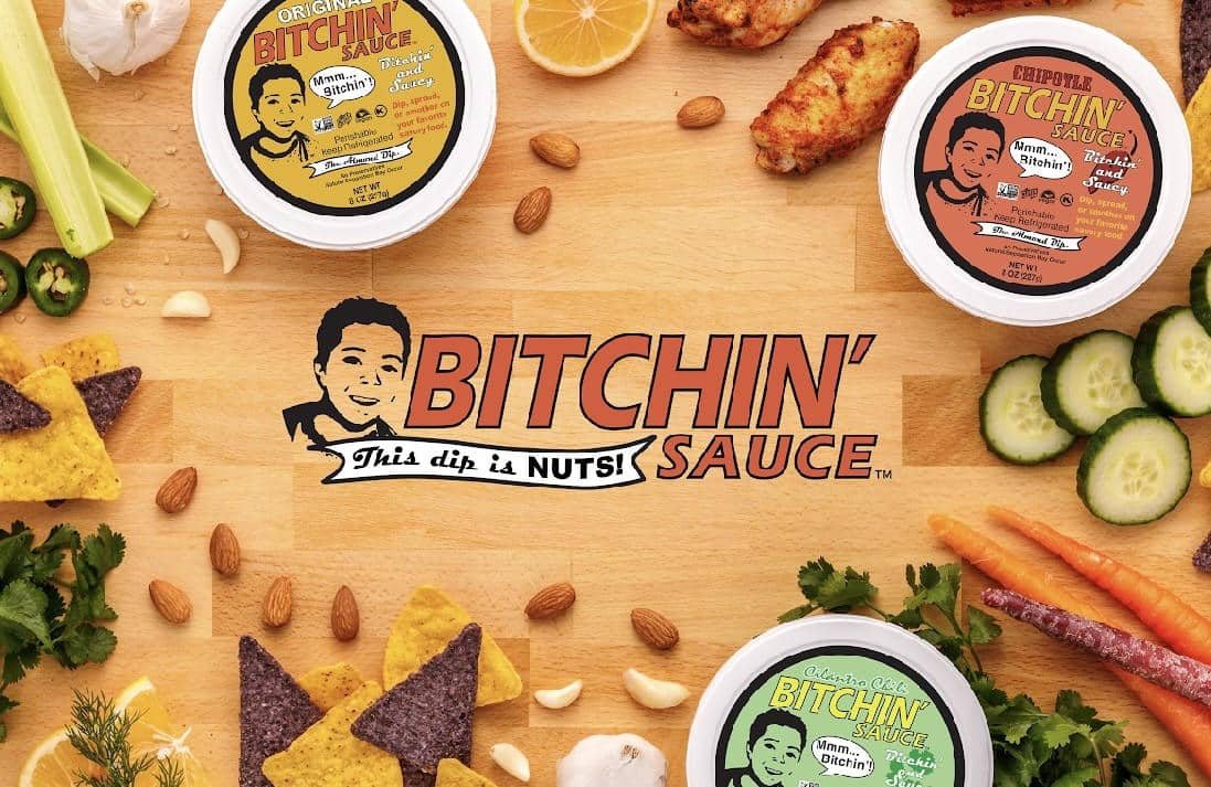 bitchin sauce logo next to containers of sauce and sliced vegetables.