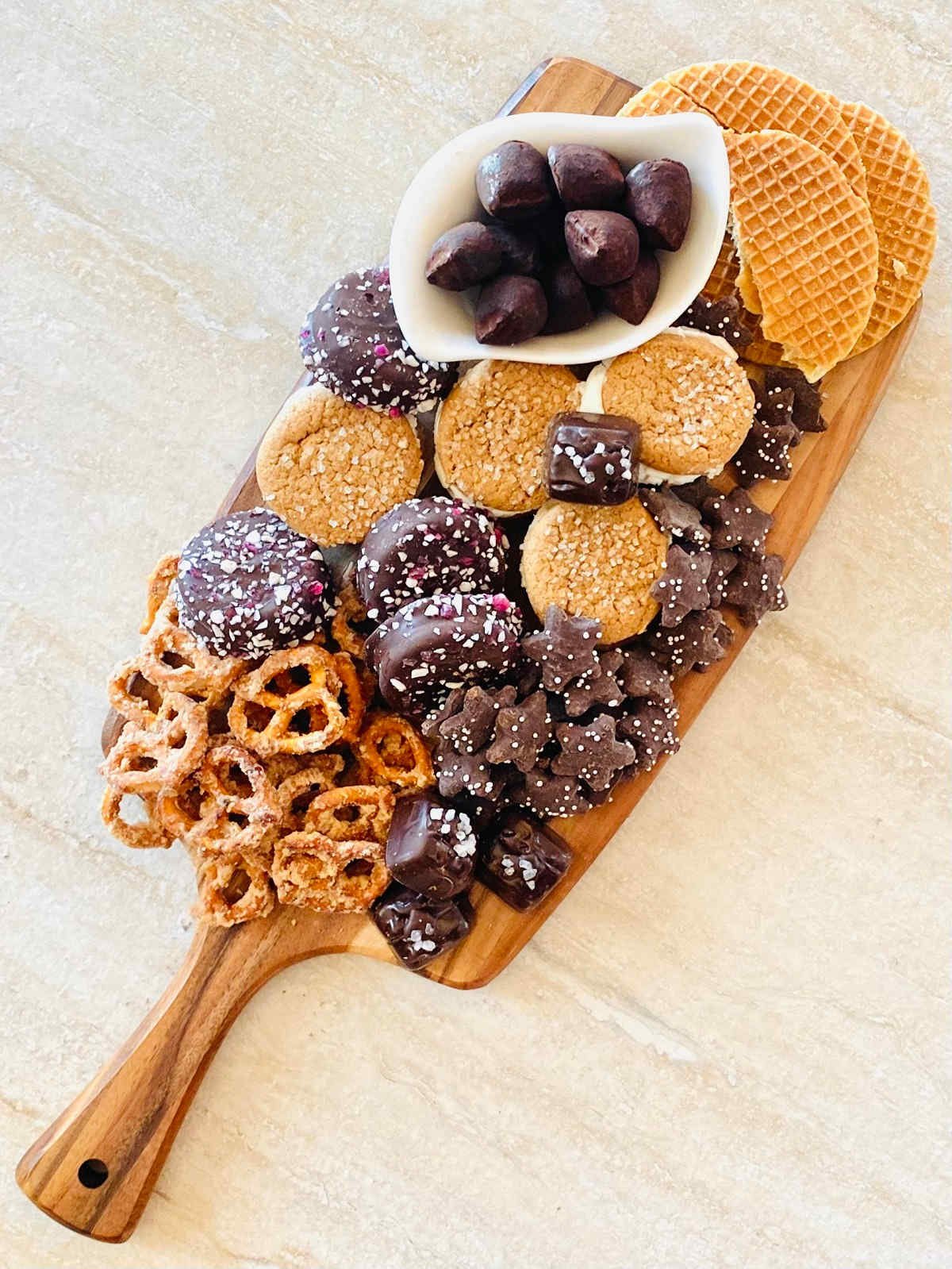 sweets charcuterie board with desserts and candies