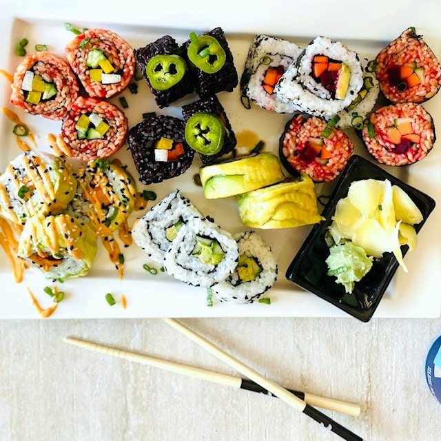vegetable-sushi--different-kinds-on-plate-next to chopsticks