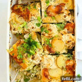 Sliced salmon bake with potatoes and broccoli, ready to serve.