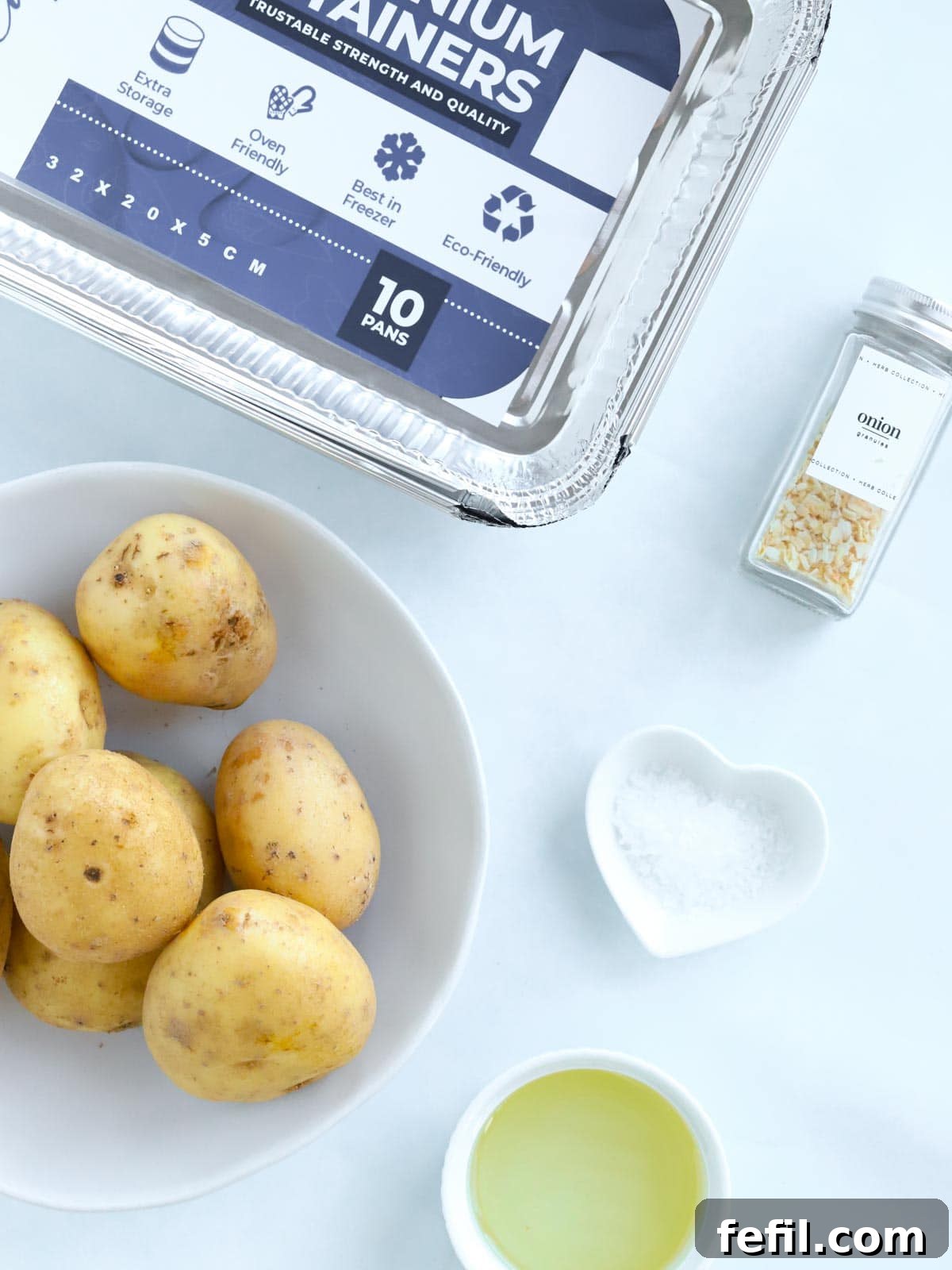 Easy Roast Potatoes recipe ingredients all laid out on a counter.