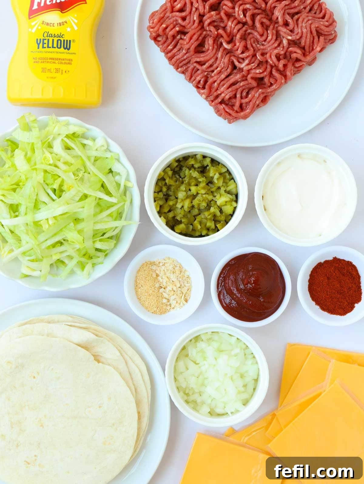 Big Mac Taco Mashup 4 Ingredients laid out on a counter, including ground beef, tortillas, cheese slices, and spices for the Big Mac Tacos.