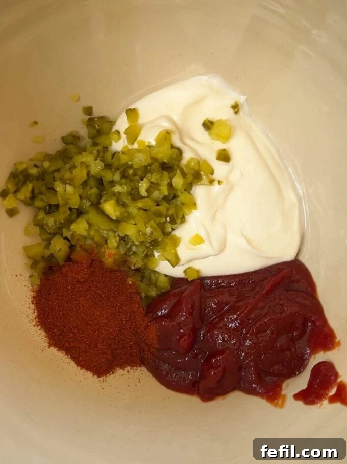 Big Mac Taco Mashup 5 Spices and sauce ingredients mixed together in a bowl, ready to be combined with the mince.