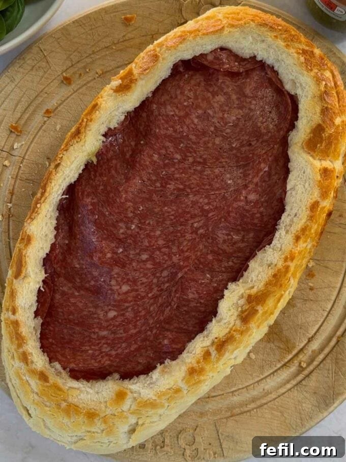 Ham in a hollowed out bread loaf as the next layer in a muffaletta picnic loaf).
