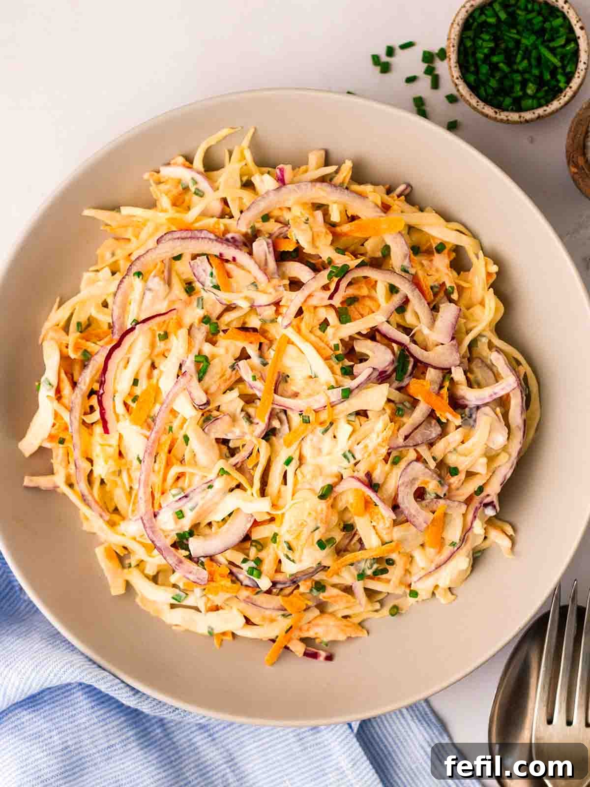 A vibrant bowl of freshly made homemade coleslaw, ready to be served.
