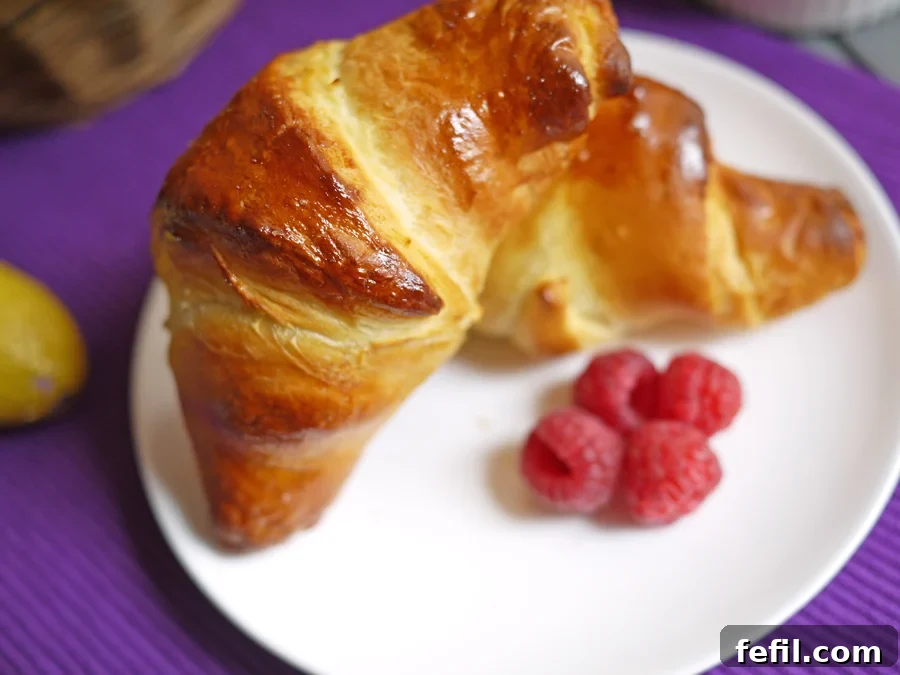 Close-up of baked Cadbury Caramel Egg Croissant with melted caramel oozing out.