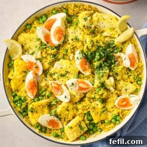 Classic Kedgeree: Smoked Fish, Rice & Curried Eggs 11 A close up of a pan of Kedgeree, with a bright colour, rice, fish and eggs.